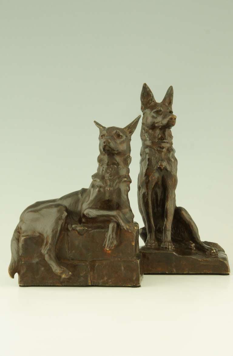 A pair of bronze shepherd dog bookends by Maximilien Fiot, France. 1
