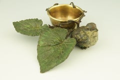 A cold painted Vienna bronze tray with a bird on a branch with leaves.