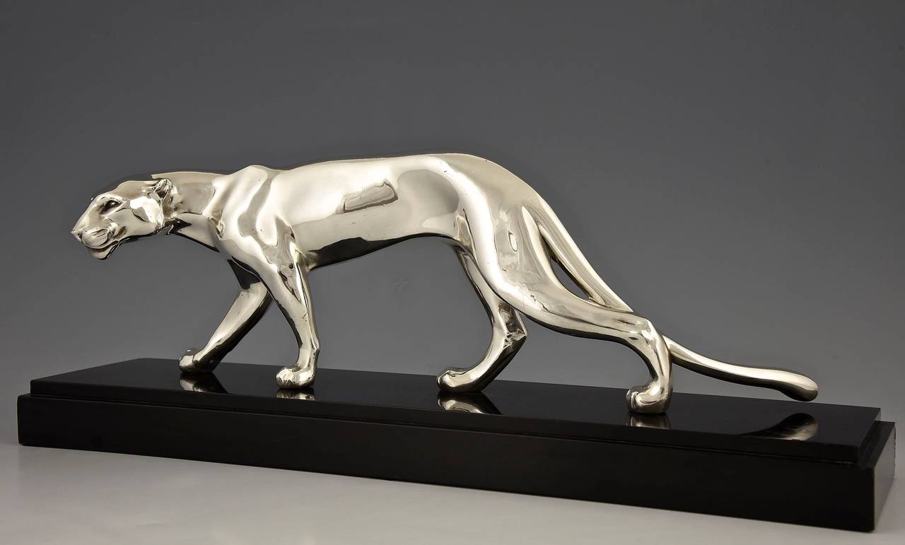 Art Deco silvered panther. 
Artist: M. Font.  France.
Signature: M. Font on the marble base.
Style:  Art Deco. 
Date:  1930. 
Material: Silver plated metal.  Black marble base. 
Origin:  France. 
Size:  
H. 7.3 inch x L. 20 inch x W. 5.5