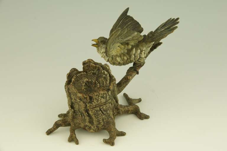 Austrian Antique Vienna bronze inkwell with bird perched on a tree trunk.