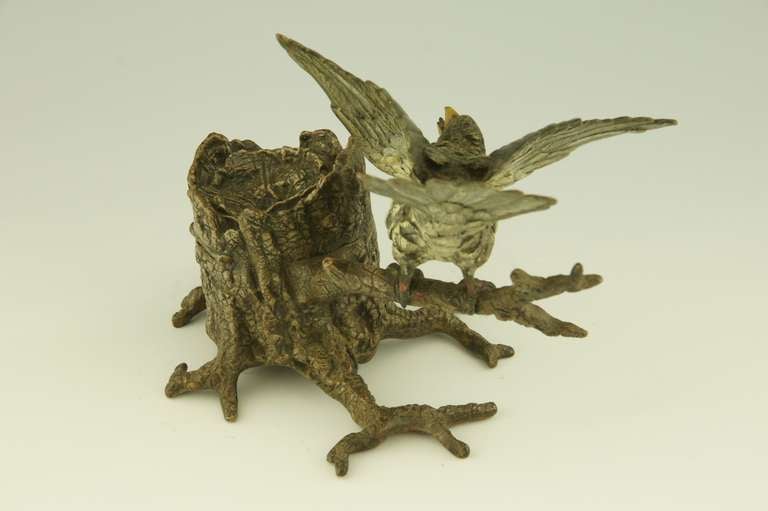 20th Century Antique Vienna bronze inkwell with bird perched on a tree trunk.