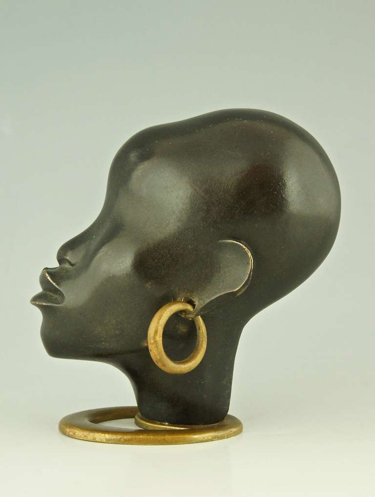 Art Deco A Head of an African Woman with Earring on Oval Base by F. Hagenauer