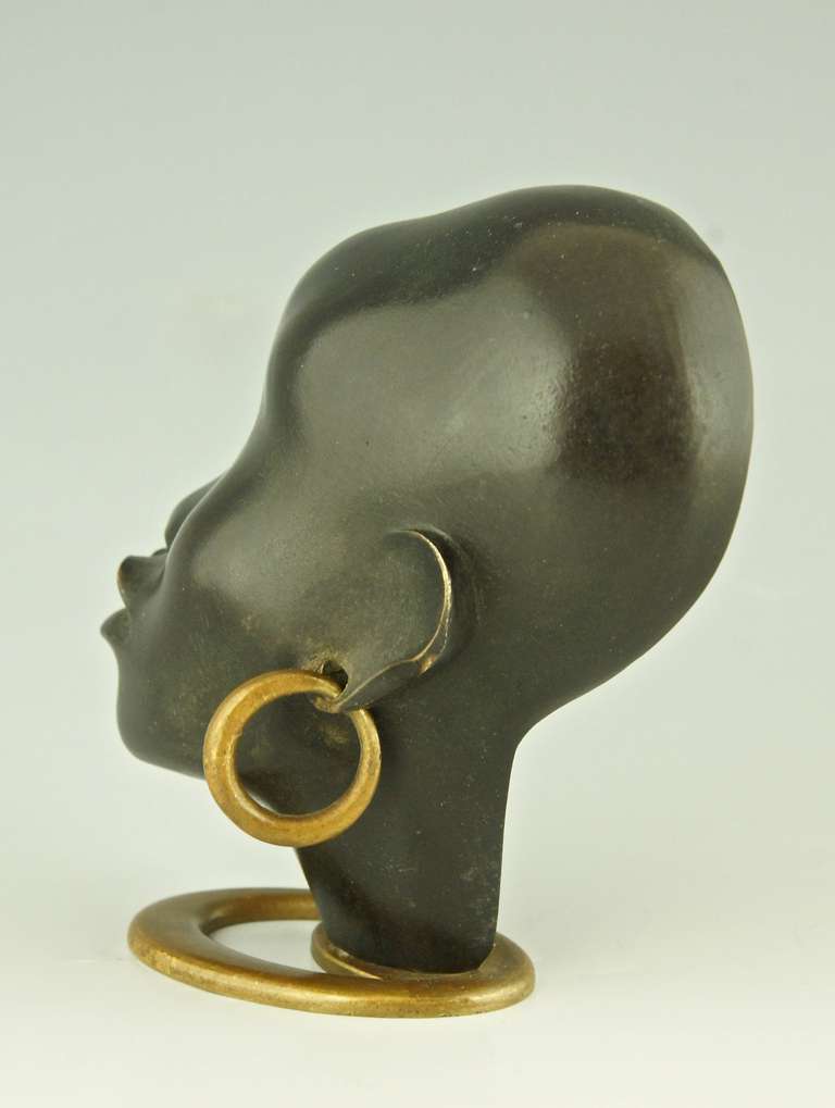 A Head of an African Woman with Earring on Oval Base by F. Hagenauer In Excellent Condition In Antwerp, BE