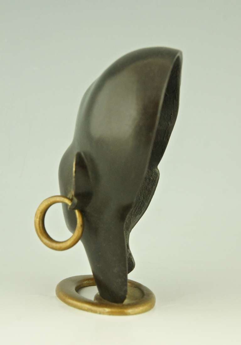 Mid-20th Century A Head of an African Woman with Earring on Oval Base by F. Hagenauer