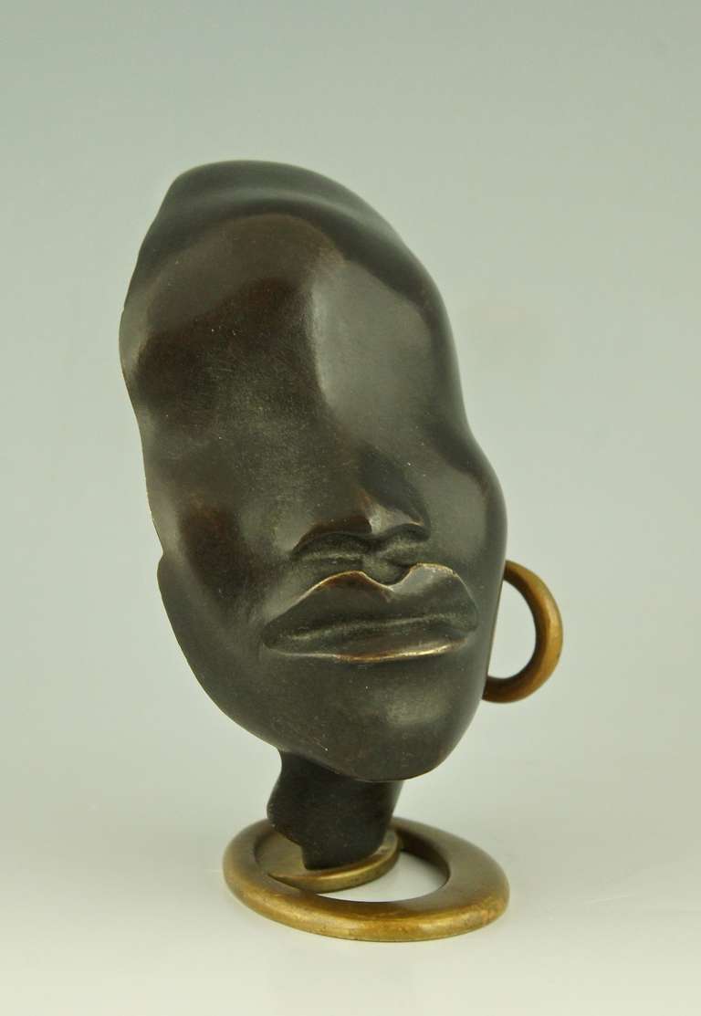 Bronze A Head of an African Woman with Earring on Oval Base by F. Hagenauer