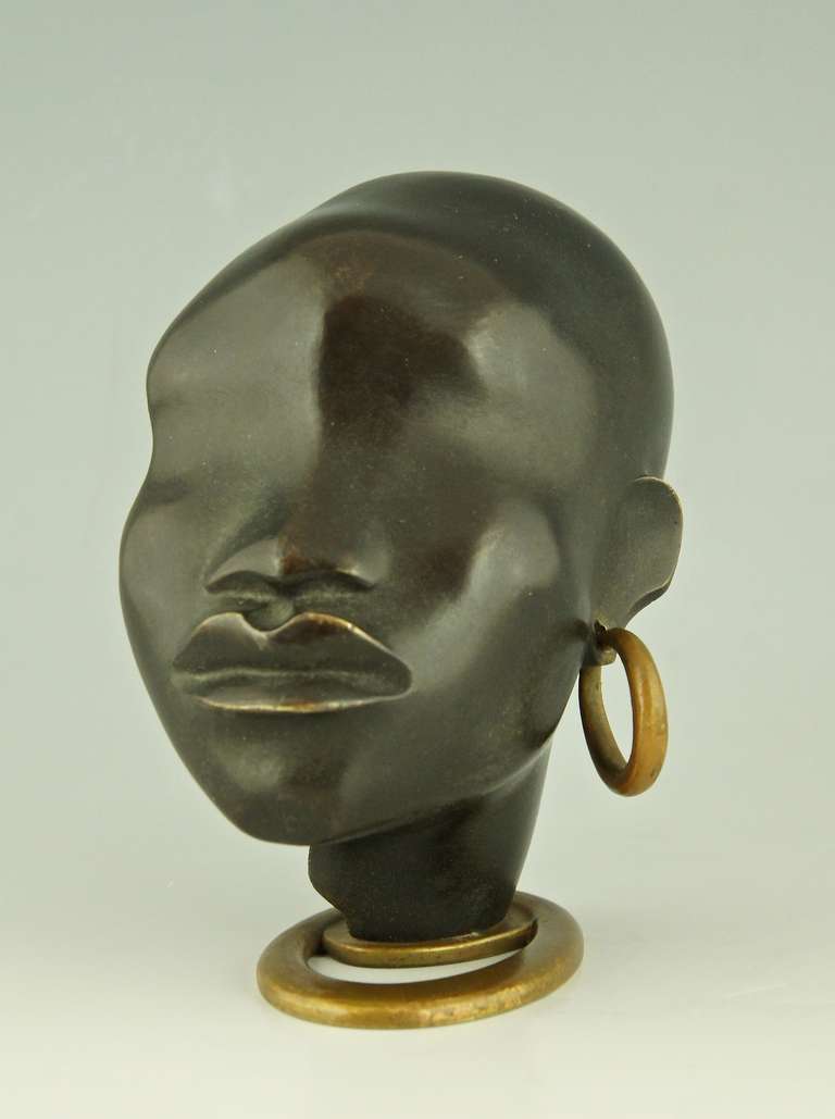 Austrian A Head of an African Woman with Earring on Oval Base by F. Hagenauer
