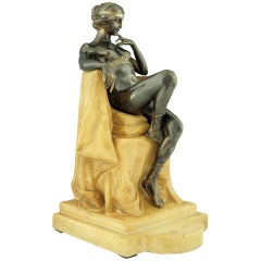 Art Nouveau bronze nude sitting in a chair by E. Tadolini, 1918.