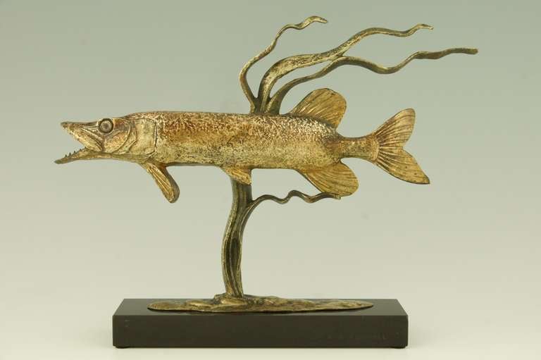 Art deco sculpture of a pike with water plants. 
Signed by Andre Vincent Becquerel.
 
Literature: 
“Art deco and other figures” by Brian Catley, Antique collectors club. 
“Animals in bronze” by Christopher Payne. Antique collectors club.