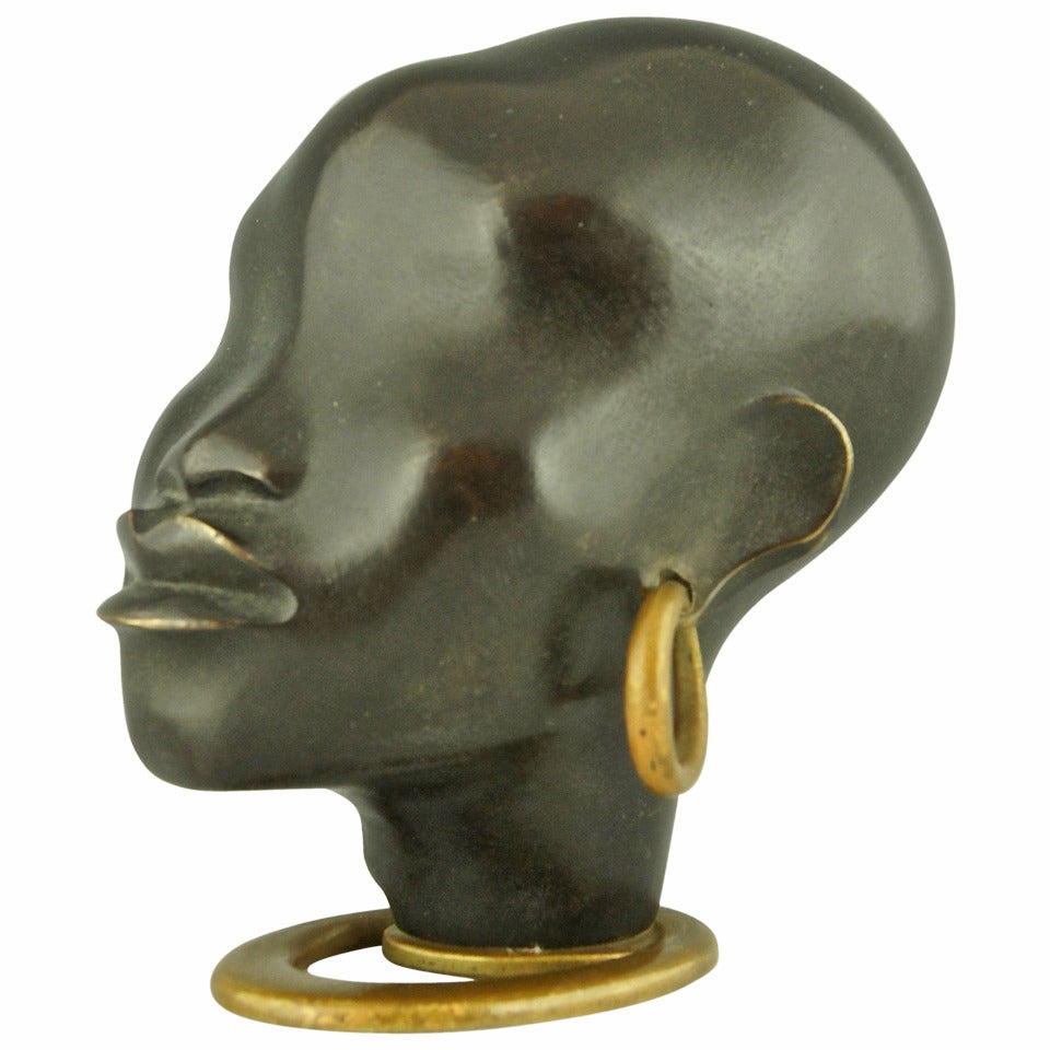 A Head of an African Woman with Earring on Oval Base by F. Hagenauer