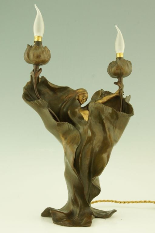 FedEx priority shipping for this item: $ 295

An Art Nouveau bronze lamp depicting Loïe Fuller.

By Anton K Nelson. 

Information about the artist:
“Bronzes, sculptors and founders” by H. Berman, Abage. 
“Etains 1900” Philippe Dahan, les