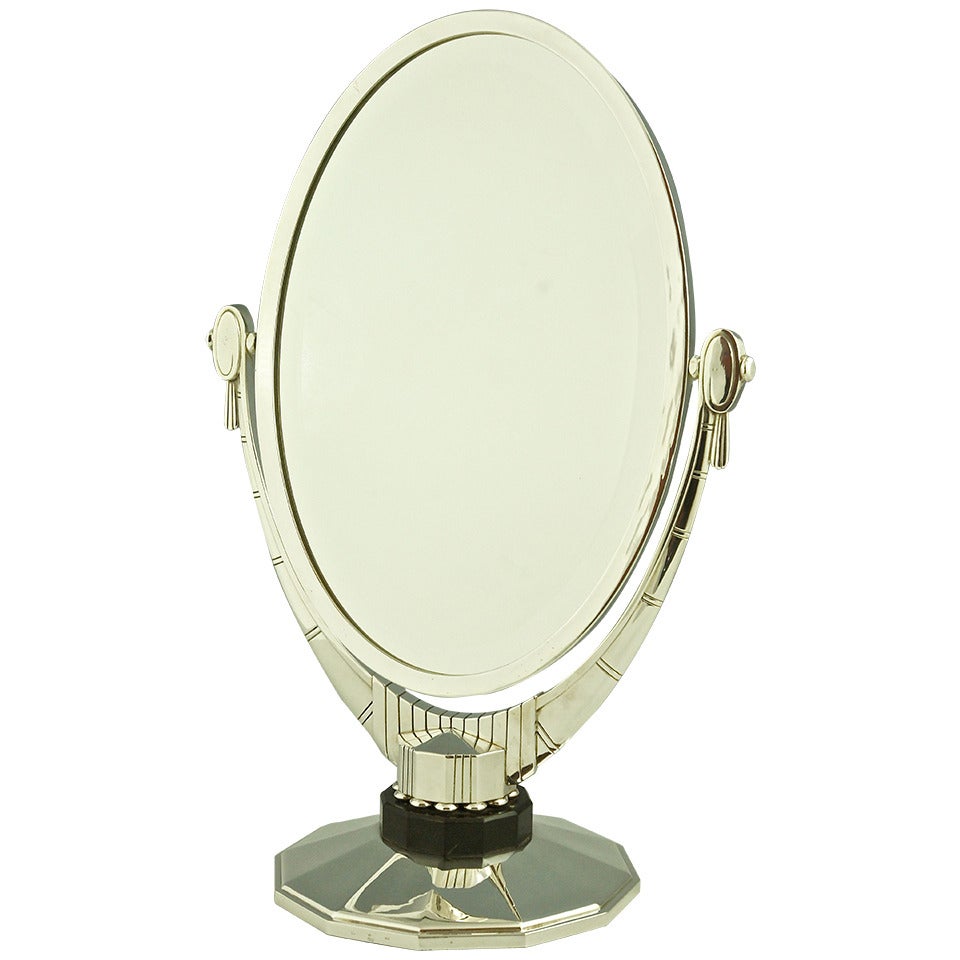 An Oval Art Deco Mirror with Beveled Glass by Atelier Raynaud, France