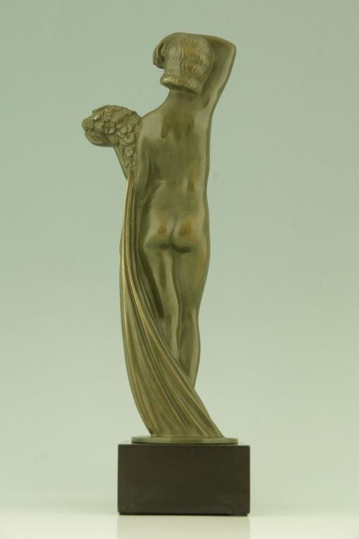 Hungarian Art Deco Bronze sculpture of a Nude with Flowers by Zoltan Kovats 1930