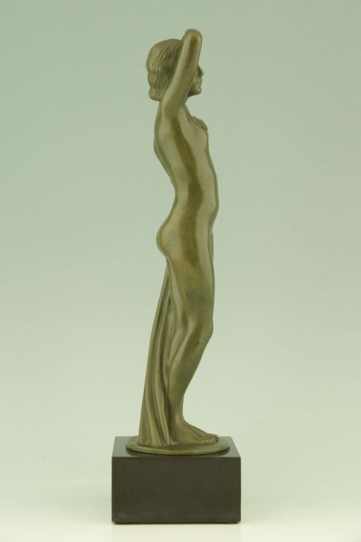 Patinated Art Deco Bronze sculpture of a Nude with Flowers by Zoltan Kovats 1930
