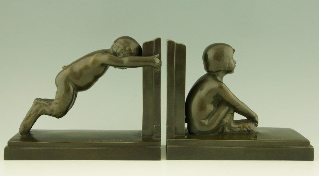 Fedex shipping for this item: $ 225

Art Deco styled figures on bookends representing male and female satyr.
Reduced version of the “Miroir d’eau” fountains in Paris and Lucerne.
 
Artist/ Maker: Paul Silvestre. 
Signature/ Marks: Silvestre,