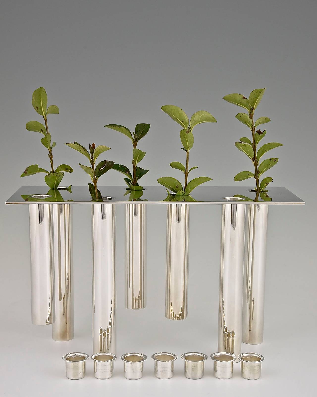 Pompei, a seven lights candelabra or flower holder designed by Gio Ponti for Christofle in original case. 
Artist:  Gio Ponti. 
Maker:  Christofle. 
Signature/ Marks:  Christofle, Mark OC.
Artist signature: Gio Ponti, 
Style: 1950s. 
Date: 