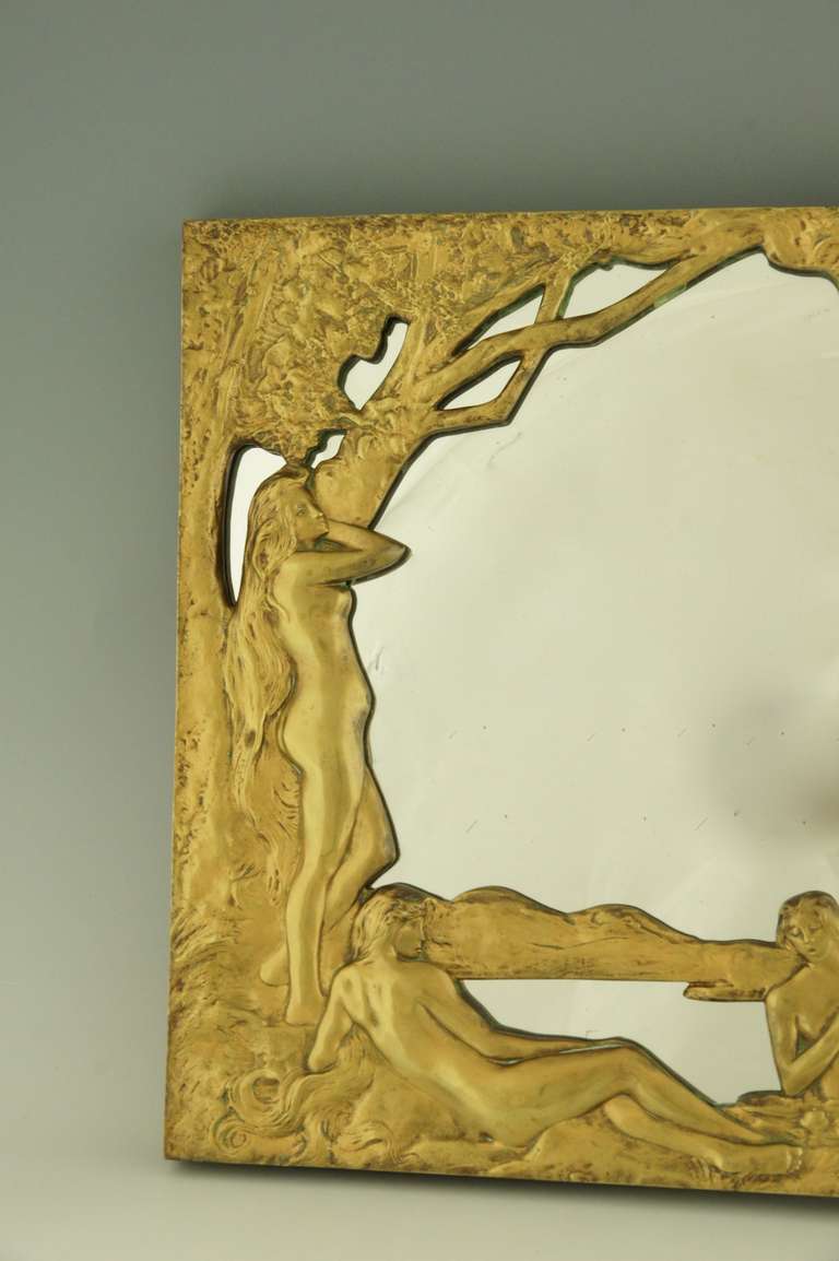 A bronze art nouveau mirror with bathing nudes.
By: Henri Levasseur, 1853-1934, Paris.  

Literature: 
The Paris salons 1895-1914 by Alastar Duncan by the Antique Collectors Club.
Etains 1900 Philippe Dahan. Les éditions de l’amateur.
Les