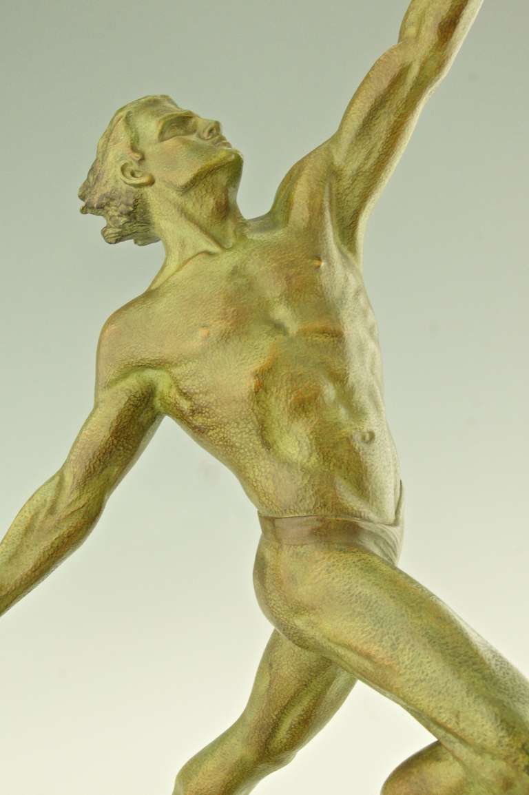 Art deco bronze of a man with a flaming torch by Frederic Focht 1