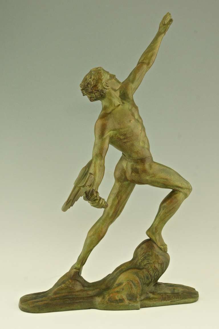 20th Century Art deco bronze of a man with a flaming torch by Frederic Focht