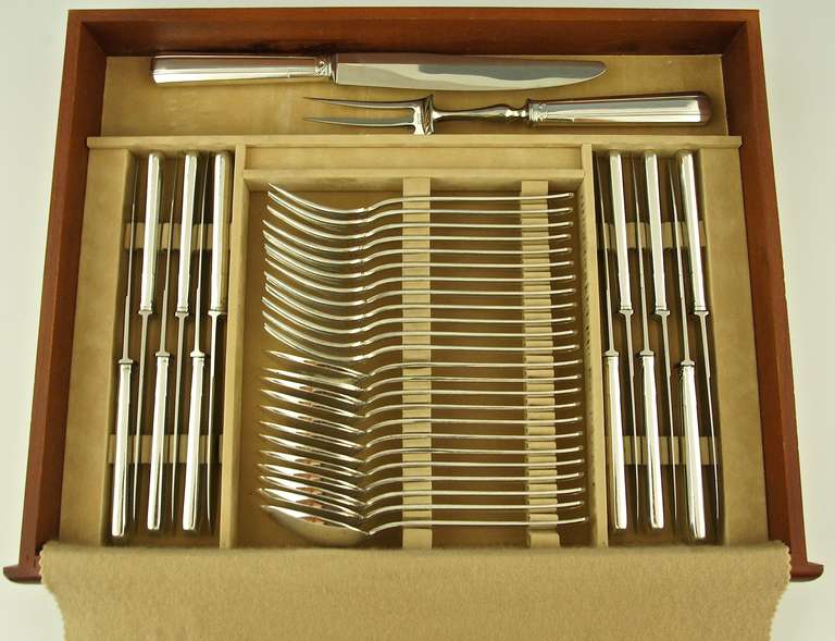 An extensive art deco silver plated cutlery set for 12 people.
116 pieces. 9 x 12 = 108 minus one (one fish fork is missing)
9 serving utensils.
The set is contained in a 3 decks wooden box.

Maker: Perrin. France.
Marks: Perrin mark. 
Style: