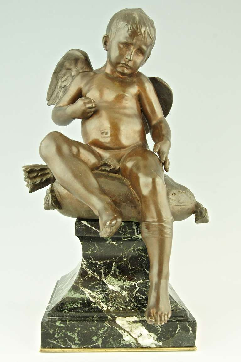 Antique bronze sculpture of a seated Cupid. 
By Antonin Merce, 1845-1916.

Signature & Marks: A. Mercie, Siot Foundry seal. 
Style: Romantic.		
Date: 1880.		
Material: Bronze with brown patina. Green marble base.