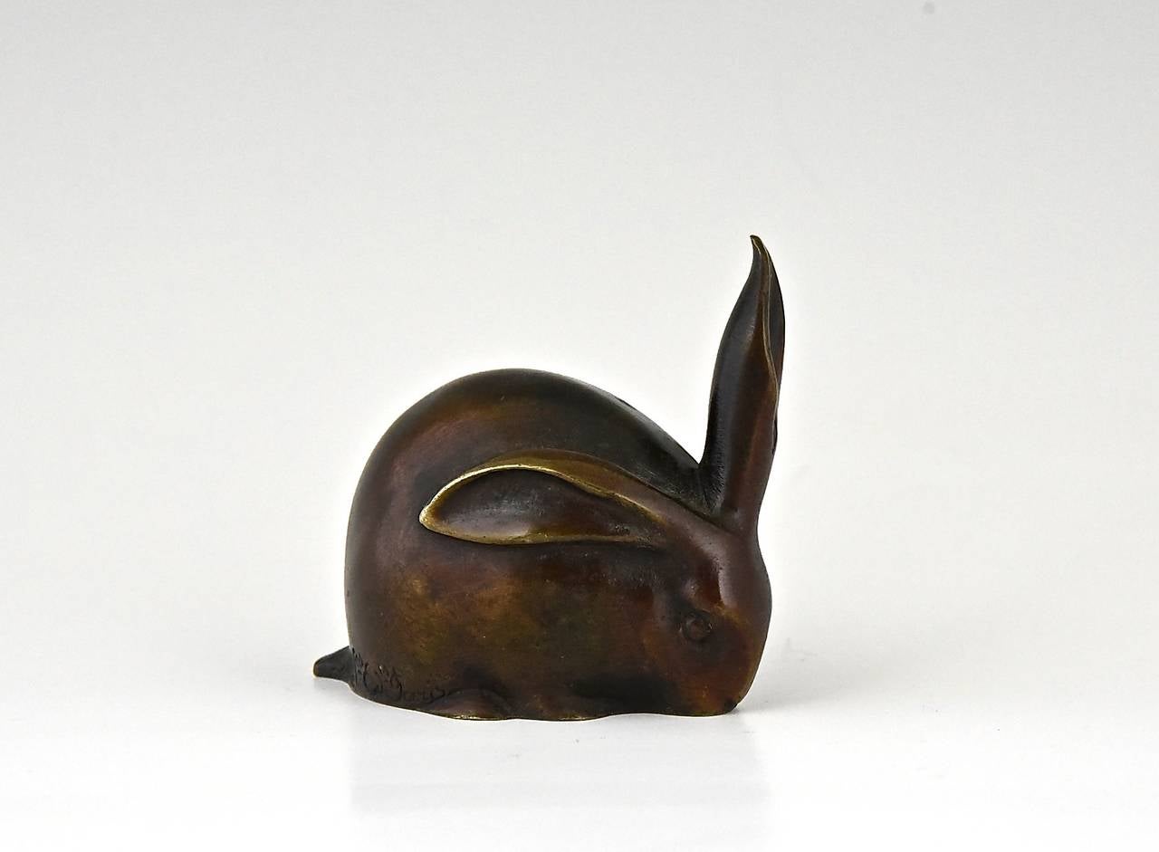 Description;  Art Deco bronze sculpture of a rabbit
Edouard Marcel Sandoz.(1881-1973)

Signature/ Marks:  Ed.M. Sandoz Susse Frères Ed.  
Style:  Art Deco. 

Date:  Ca. 1919-1930.
Material:   Patinated bronze. 
Origin:  Born in Switzerland,