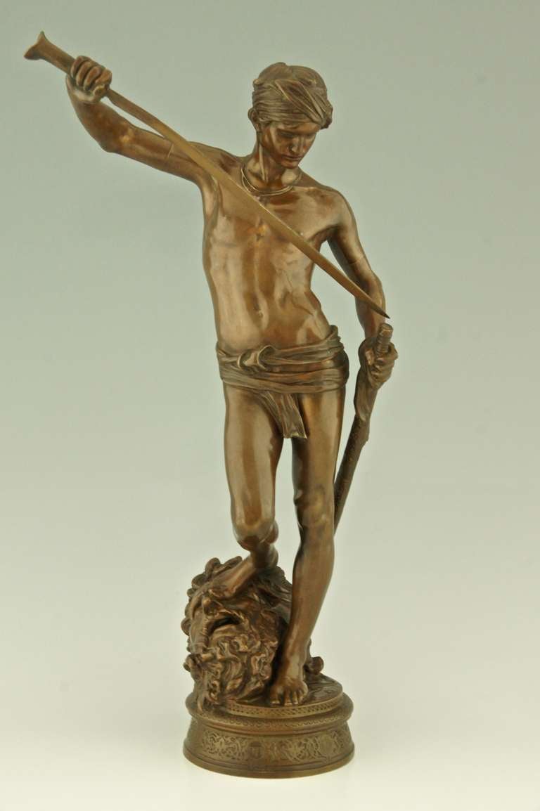 David after the combat.
By Antonin Mercié 1845-1916.
Signature  A. Mercié, Barbedienne Paris, Collas seal. 

Literature: 
“Les bronzes de XIXe siècle” by Pierre Kjellberg, Les éditions des amateurs. Page 490 
“Bronzes, sculptors and founders”