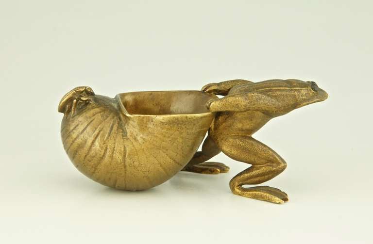 Bronze sculpture of a frog pulling a snail shell with insect.  This model was also sold as car mascot. 
Signed Louchet. 

Literature: 
 “Bronzes, sculptors and founders” by H. Berman, Abage. 

Fedex shipping: $ 55