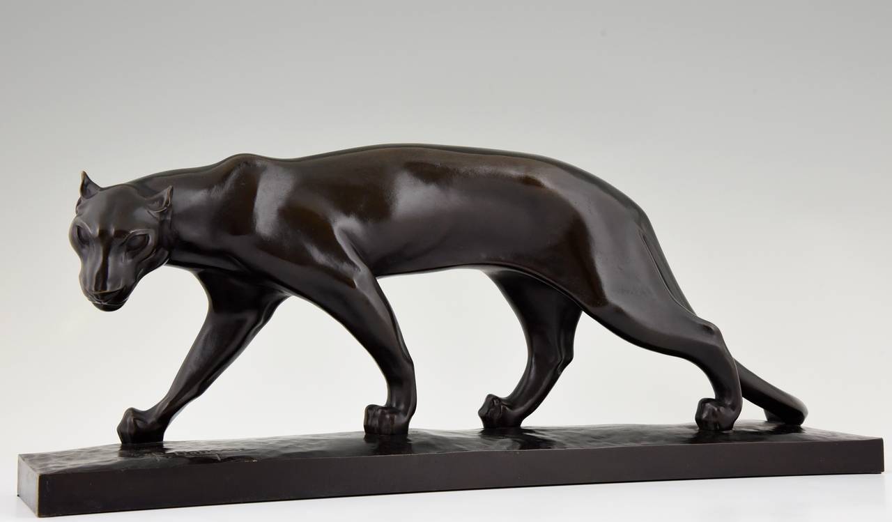 Art Deco bronze sculpture of a walking panther. 
By Santiago Bonome.  Born in Spain, worked in France. 
Signature:  Bonome. F. Barbedienne foundry mark. 
Style: Art Deco. 
Date 1930. 
Material: Bronze with black patina. 
Origin:  France.