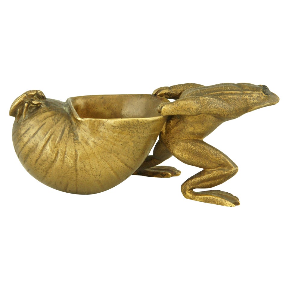 Bronze sculpture of a frog pulling a snail shell with an insect by Louchet.