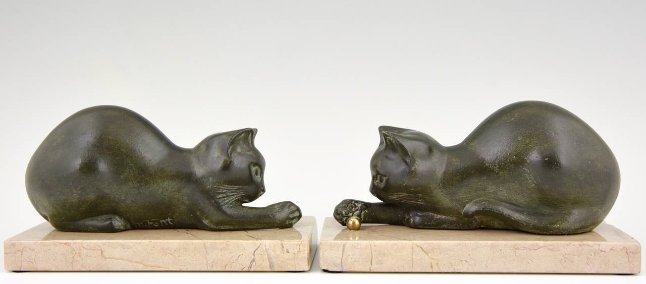 Description:  Art Deco patinated metal cat bookends. 
Artist/ Maker:  M. Font.
Signature/ Marks: M. Font.

Style:  Art Deco. 
Date:  1935. 
Material: Green patinated metal.  Copper ball.  Marble base. 
Origin:  France. 

Size of one: 
H.