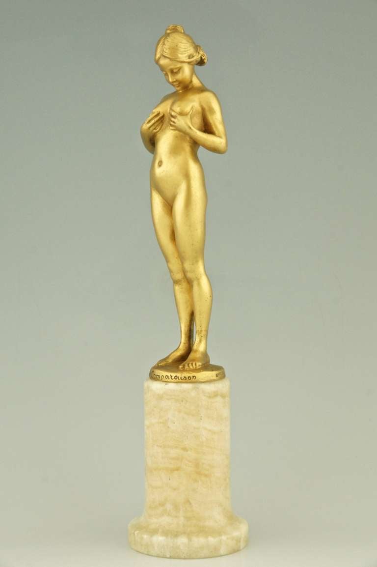  “La comparaison” , A bronze of a young girl comparing her breasts.  
By  Antoine Bofill,  Worked in France 1895 / 1925.
Signature/ Marks:  Bofill. Patrouiileau éditeur, Paris.  Bronze. 
Style:  Art Nouveau. 		
Date:  1905.			
Material:  Gilt