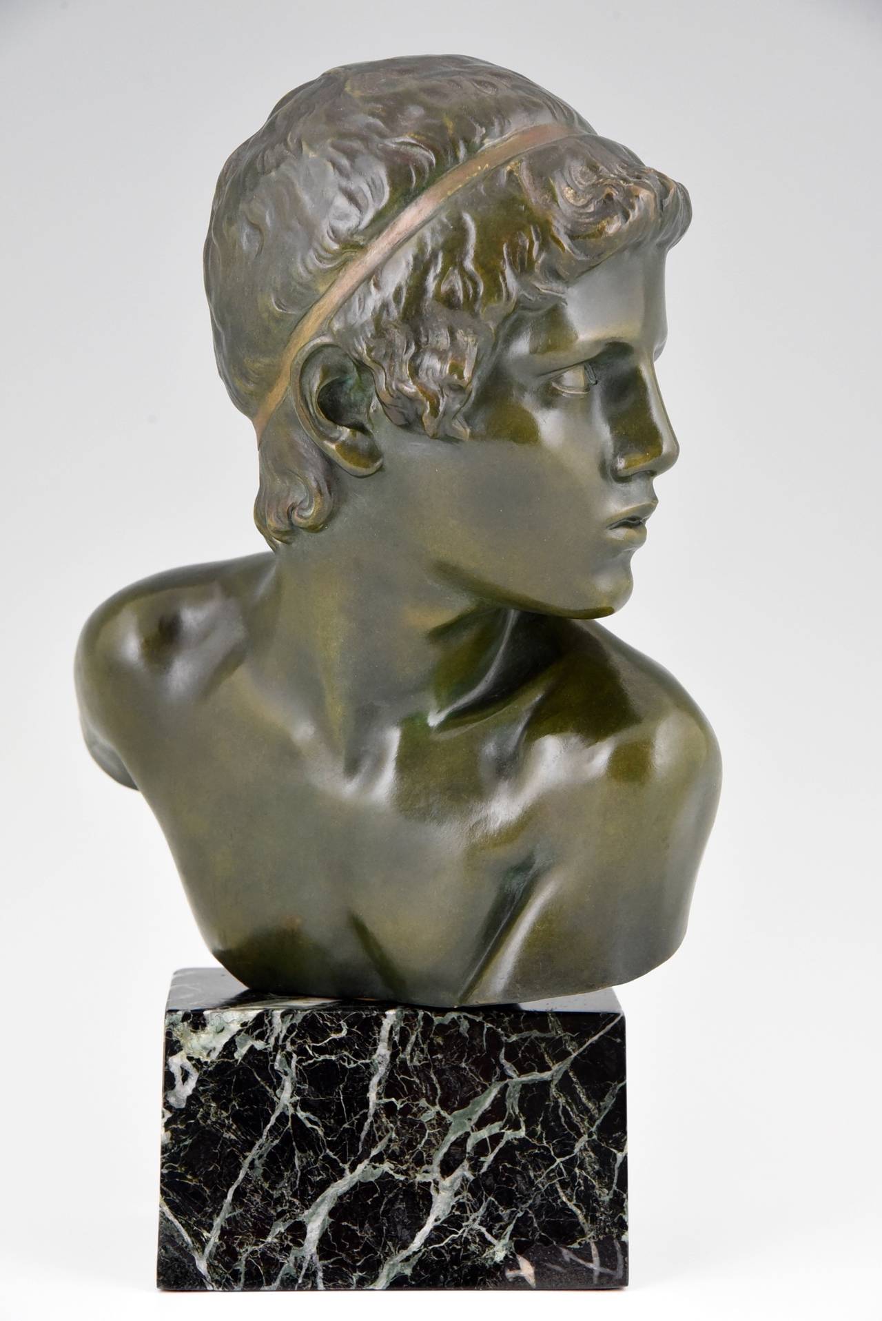Art Deco bronze bust of the young Achilles. 
By  Constant Roux (1865-1929)
Signature & Marks: 
Constant Roux, numbered.  
Foundry seal Les Neveux de J. Lehmann.
Style: Art deco.
Date: 1920.
Material:  Bronze on a green marble base.  The