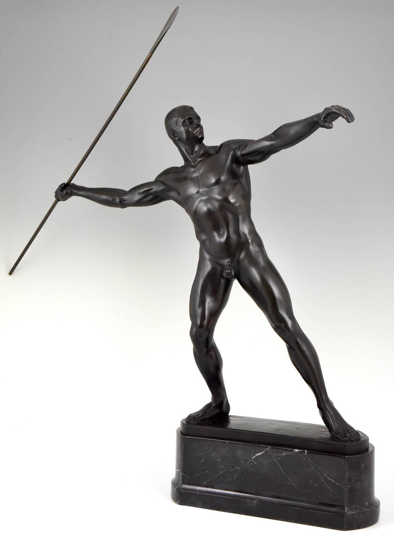 Description:  Art Deco bronze of a javelin thrower. 
Artist/ Maker: Karl Möbius, Germany 1876-1953.
Signature/ Marks: K. Möbius.  Foundry mark: Giss Heinze & Barth Berlin.
Date:  1910. 
Material:  Black patinated bronze.  Marble