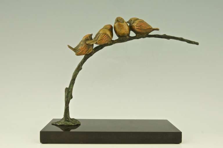  Bronze sculpture of 4 birds on an branch.
By  Irenee Rochard.
Signature/ Marks:  I. Rochard on the marble,  Bronze. 
Material:  Bronze with multi color patina, on black marble base.	
Origin:  France. 			
Size:			 
H. 23.7 cm. x L. 30 cm. x W.
