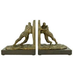 Art Deco Bronze Bookends of Two Men Pushing by Victor Demanet