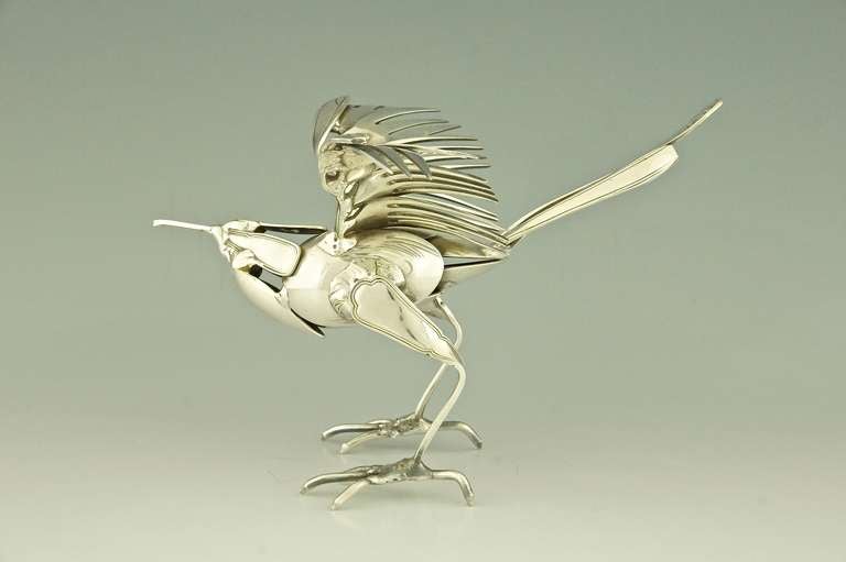 bird made out of silverware