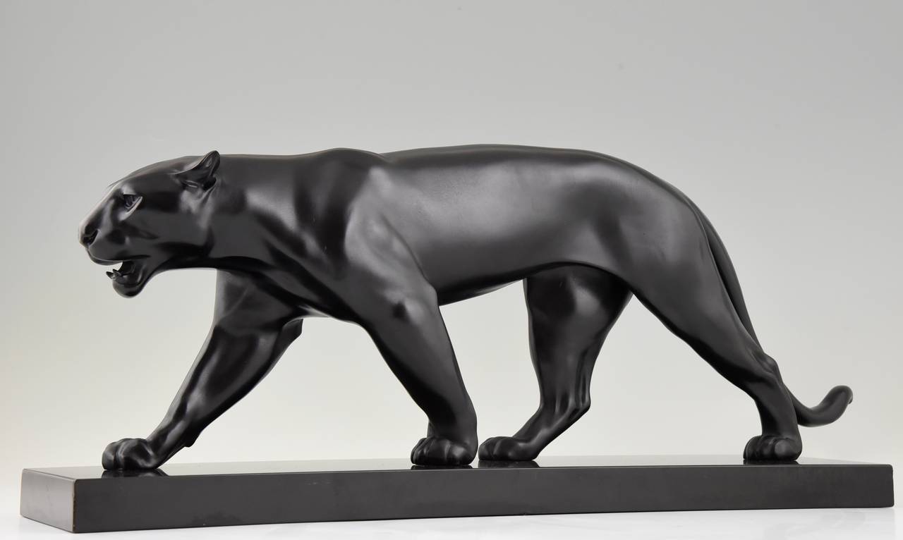 Art Deco sculpture of walking panther. 
Artist:  Max Le Verrier. 
Signature: M. Le Verrier. 
Style:  Art Deco. 
Date:  1930.
Material: Metal with black patina.  Black marble base. 
Origin:  France. 
Size:  
H 9.8 inch x L 24.8 inch x W 5.6