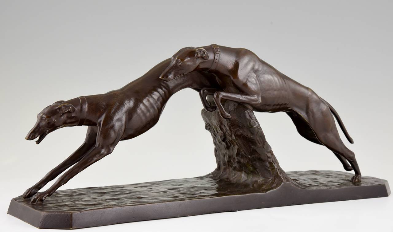 Description:  Art Deco bronze sculpture of two greyhound dog racing. 
Artist / Maker:  Charles Charles.
Signature / Marks:  C. Charles.  Patrouilleau fondeur.
Style:  Art Deco. 
Date:  circa 1930
Material:  Bronze with brown patina.
Origin: 