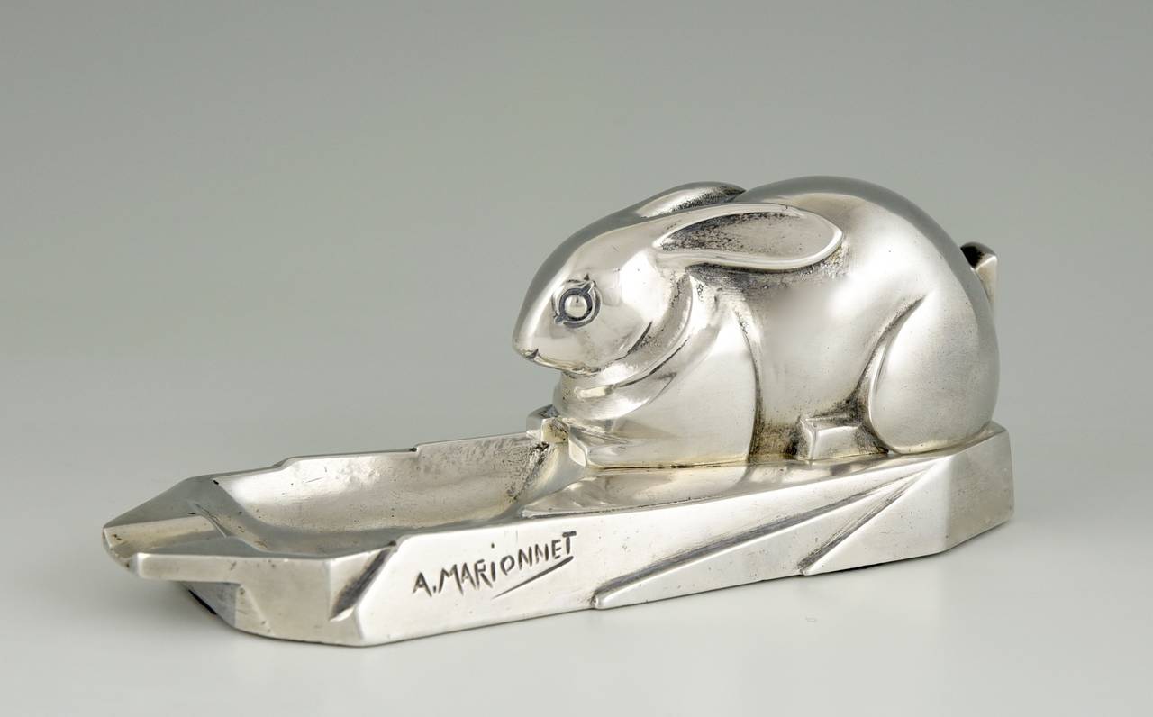 Description:  Art Deco silvered bronze ashtray with rabbit.
Artist/ Maker: A. Marionnet.
Signature/ Marks: A. Marionnet  France.
Style:  Art Deco.
Date: circa 1930.
Material: Silvered bronze. 
Origin: France.
Size:  
H 2.6 inch x L 6.5 inch