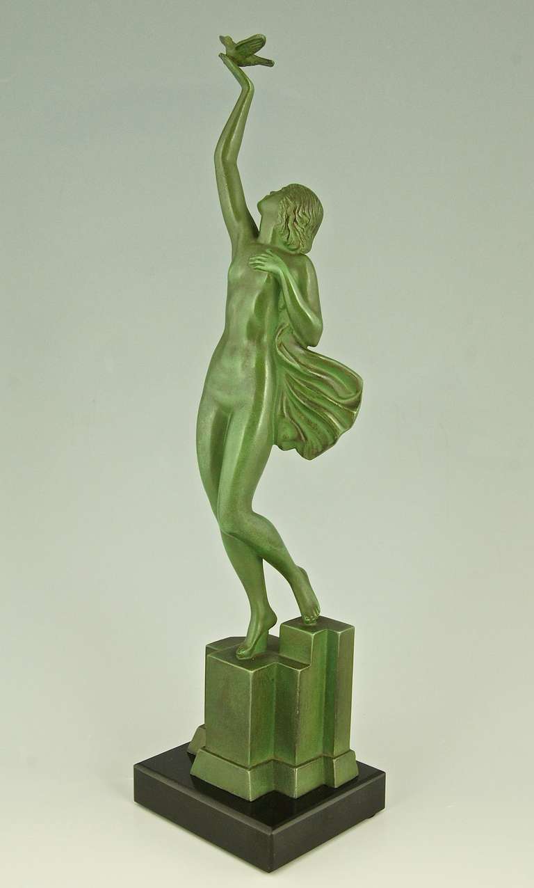 Art Deco sculpture of a nude holding a dove by Fayral, P. Le Faguays, 1930.