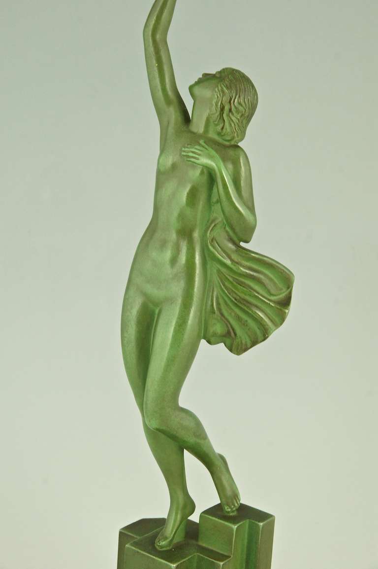 Bronze Art Deco sculpture of a nude holding a dove by Fayral, P. Le Faguays, 1930.