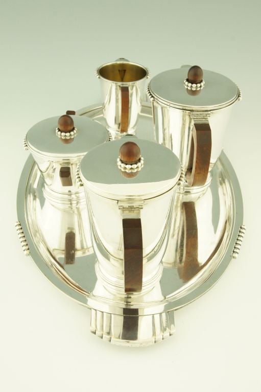 A 5 piece Art Deco tea and coffee set. Orbrille, Paris.
Marks: Orbrille stamp. Each piece is stamped and numbered. 
Literature: “Dictionnaire des poinçons” Orfèvrerie.