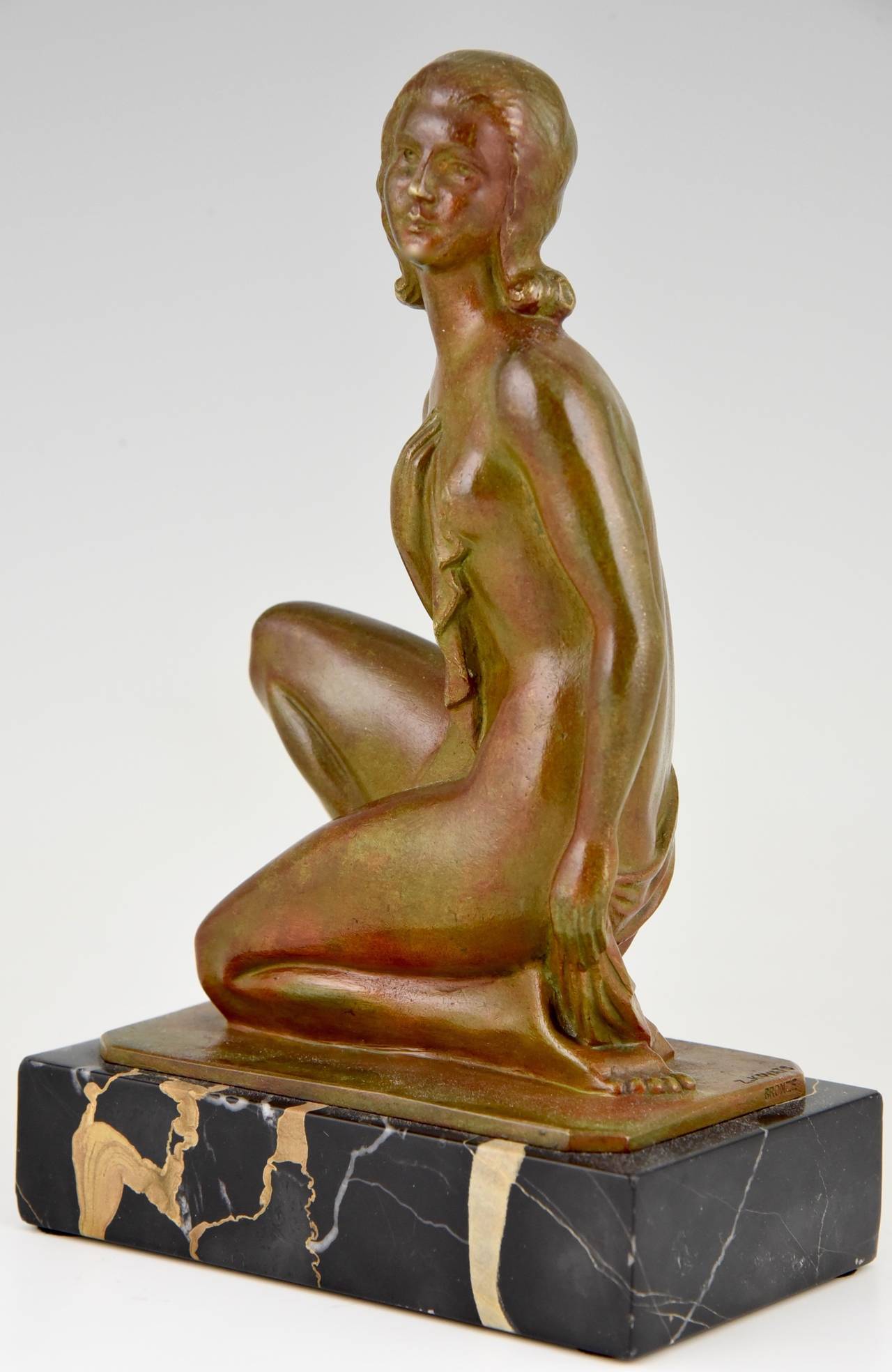 Description:  Art Deco sculpture of a nude. 
Artist:  Zoltan Kovats. Hungary, 1883-1952. 
Signature:  Z. Kovats. 
Style:  Art Deco.
Condition:  Good original condition.
Date:  circa 1925.
Materials:  Bronze, brown patina with shades.  Portor