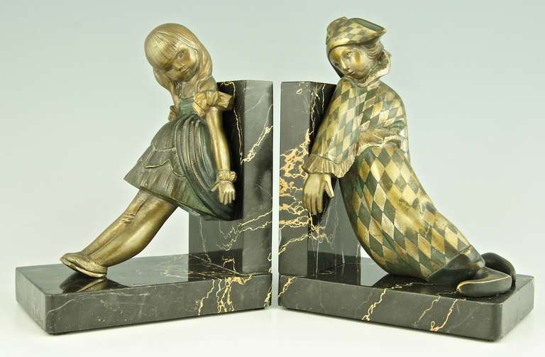 Bronze bookends with pierrot and doll. 
By Alexandre  Kelety.
Signature & Marks :  Kelety. Foundry:  Etling Paris. 

Size of one:			
H. 7.8 inch x L. 5.7 inch x W. 3.9 inch.
 H. 20 cm  x L. 14.5 cm. x W. 10 cm.
 
Literature: 
 You will find
