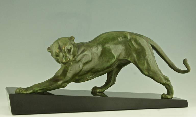 Art Deco bronze sculpture of a panther. 
By Plagnet, artist worked in France 1920-1930.
Signature and Marks:  Plagnet, Bronze
Style:  Art Deco.	
Date:  1925-1930
Material:  Bronze with green patina.  Black marble base. 	
Origin: France.