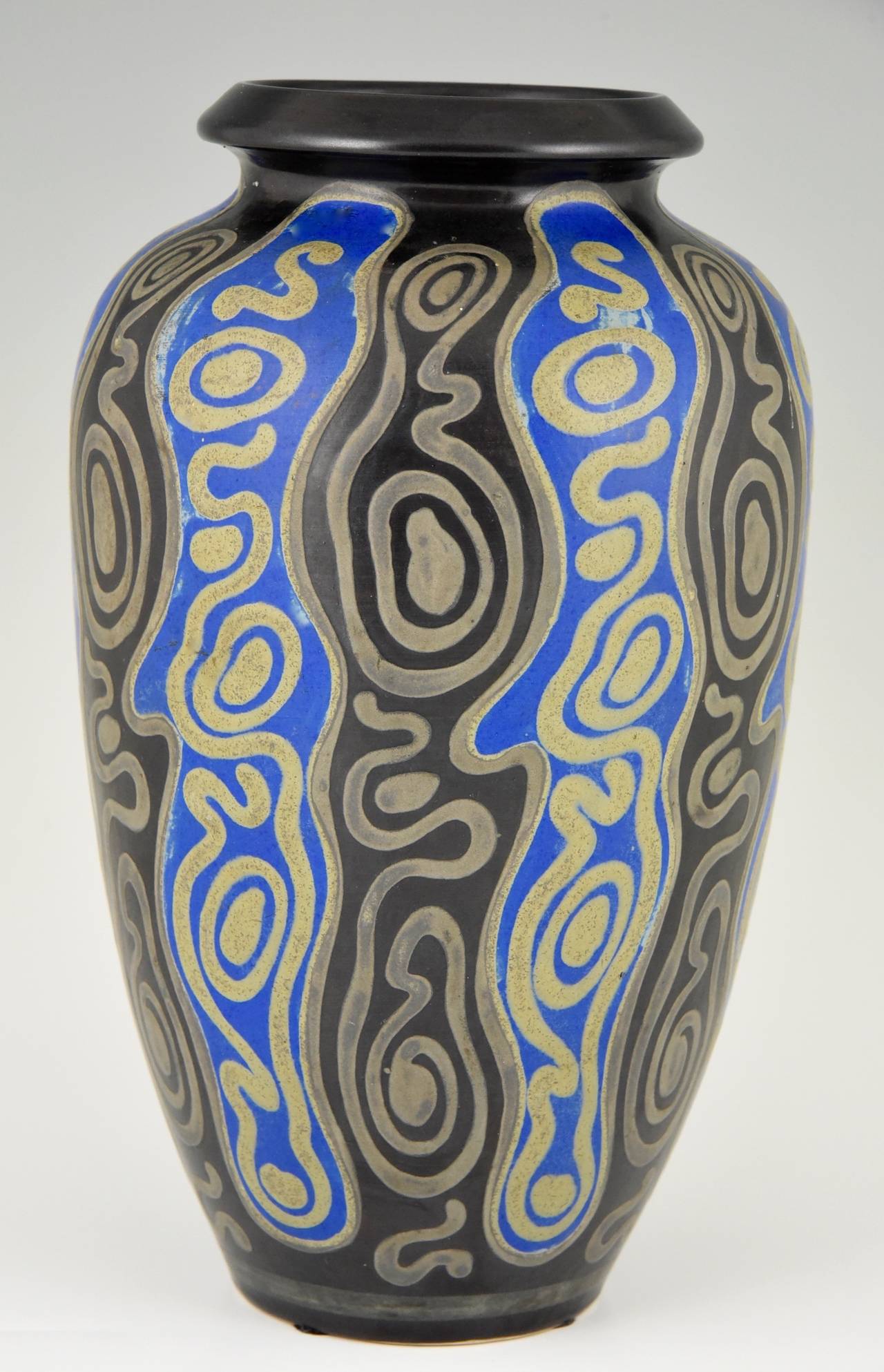 Description:  Art Deco vase with blue, grey and black decorations. 
Artist/ Maker: Charles Catteau.
Signature/ Marks: Ch Catteau, D 995, Grès Keramis, Boch freres stamp. 914. 
Style:  Art Deco.
Date:  1924/1925.
Material: Grès,