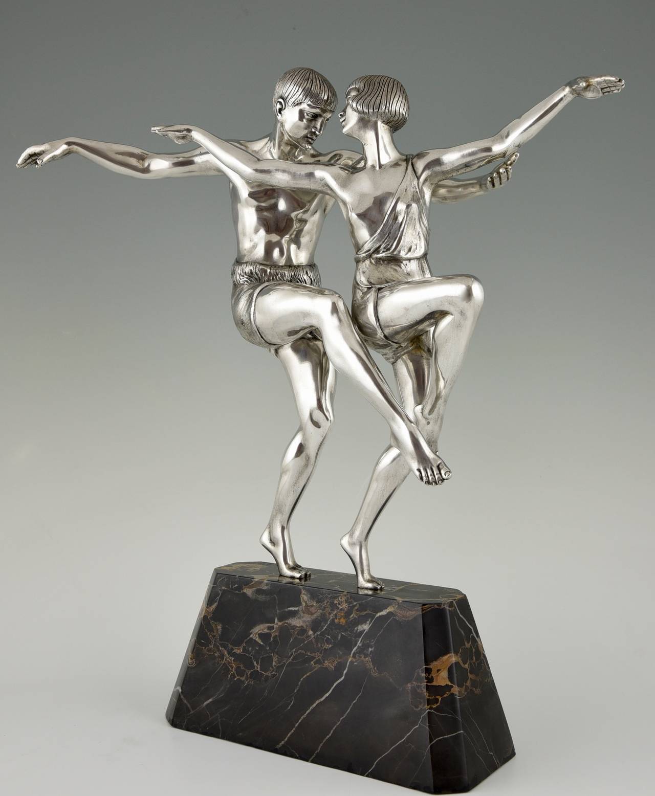 Description: Art Deco silvered bronze sculpture of a dancing couple.
Artist/ Maker: Pierre Le Faguays.
Signature/ Marks:  Le Faguays. 
Style: Art deco.
Date: circa 1930.
Condition:  Very good condition.
Material: Silvered bronze on a portor