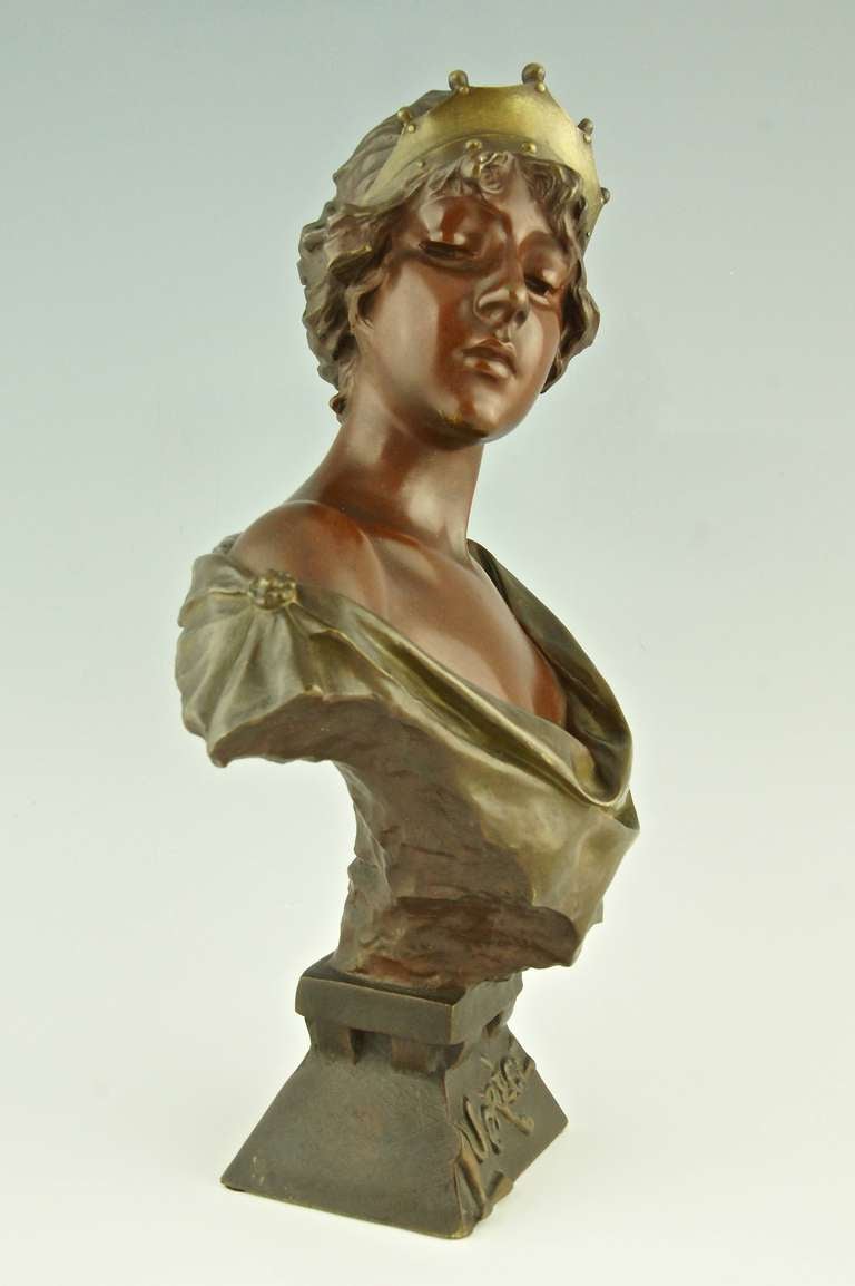 Lucrèce, bronze bust of a girl with a crown.
By Emmanuel Villanis (1858-1914)
Signature & Marks:  E. Villanis.  Foundry seal of the Société des bronzes de Paris.

Size:			
 H. 14.6 inch x L. 9.4 inch x W. 5.5 inch.
 H. 37 cm.  x L. 24 cm.  x