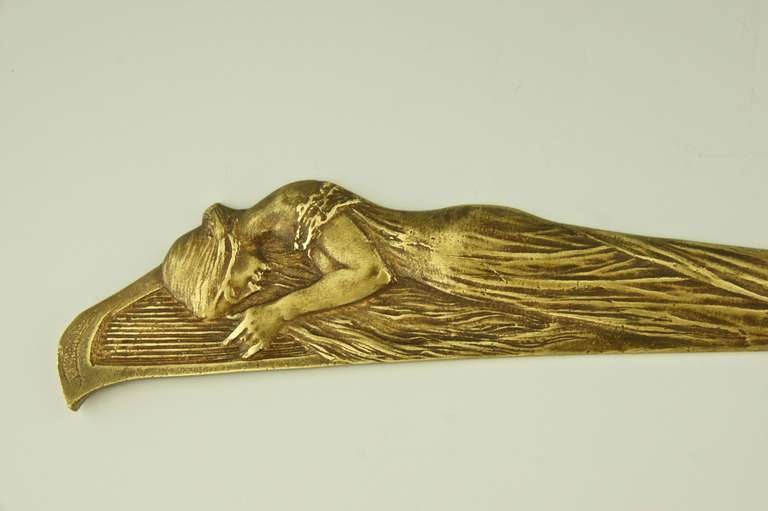 French An Art Nouveau bronze letter opener with maiden playing a harp.