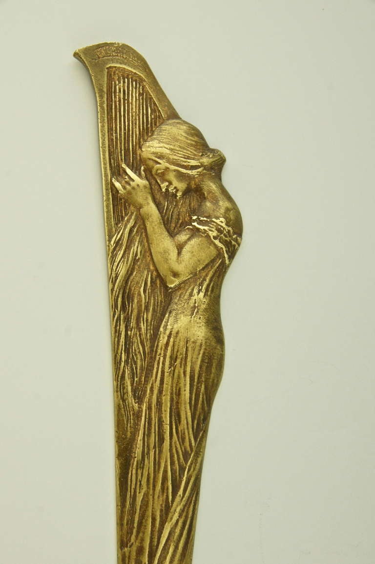 An Art Nouveau bronze letter opener with maiden playing a harp. In Good Condition In Antwerp, BE